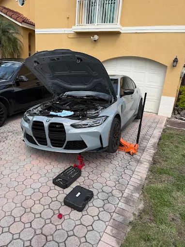 Mobile service on BMW at home driveway